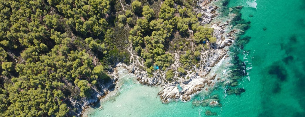 view from above the majestic beach kavourotrypes located sithonia halkidiki greece dimitris kiriakakis unsplash scaled