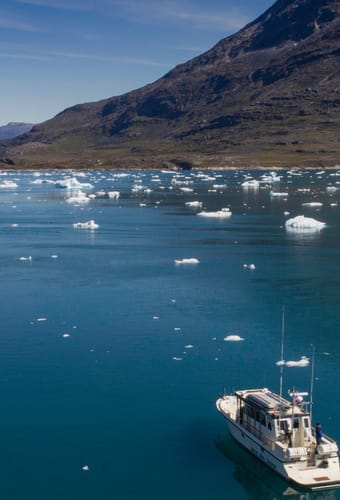 greenland boat near qoornoq greenland photo elia locardi scaled