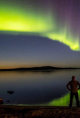 finland Lapland wilderness hotels autumn aurora man scaled