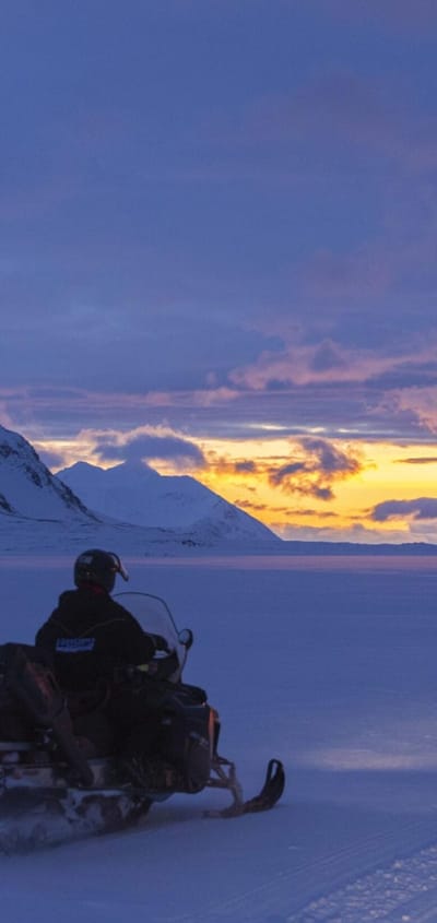 Svalbard basecamp explorer snowmobiling dark season scaled