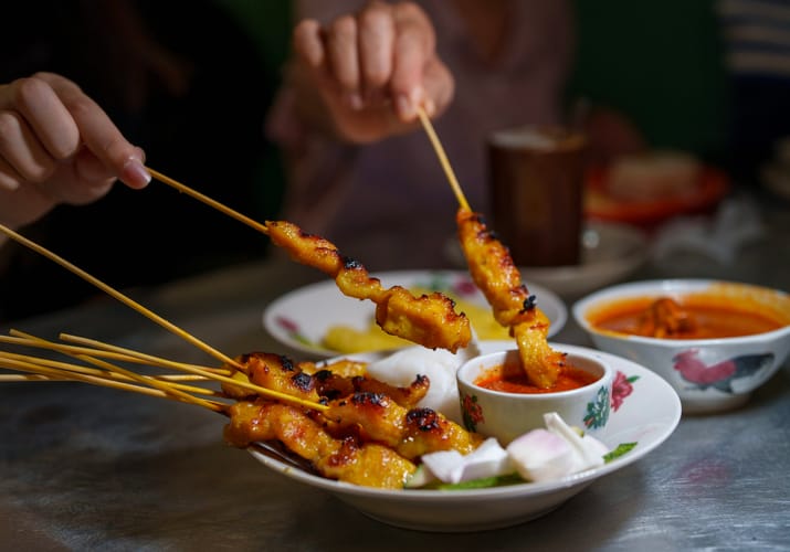 Malaysia traditional malaysian meal chicken satay street food istock scaled